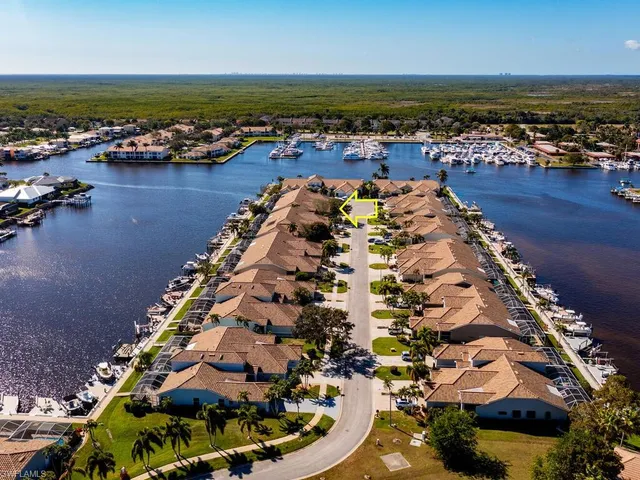 a view of a balcony with wooden floor and outdoor seating