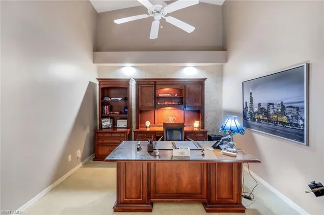 a living room with table chairs and a large mirror
