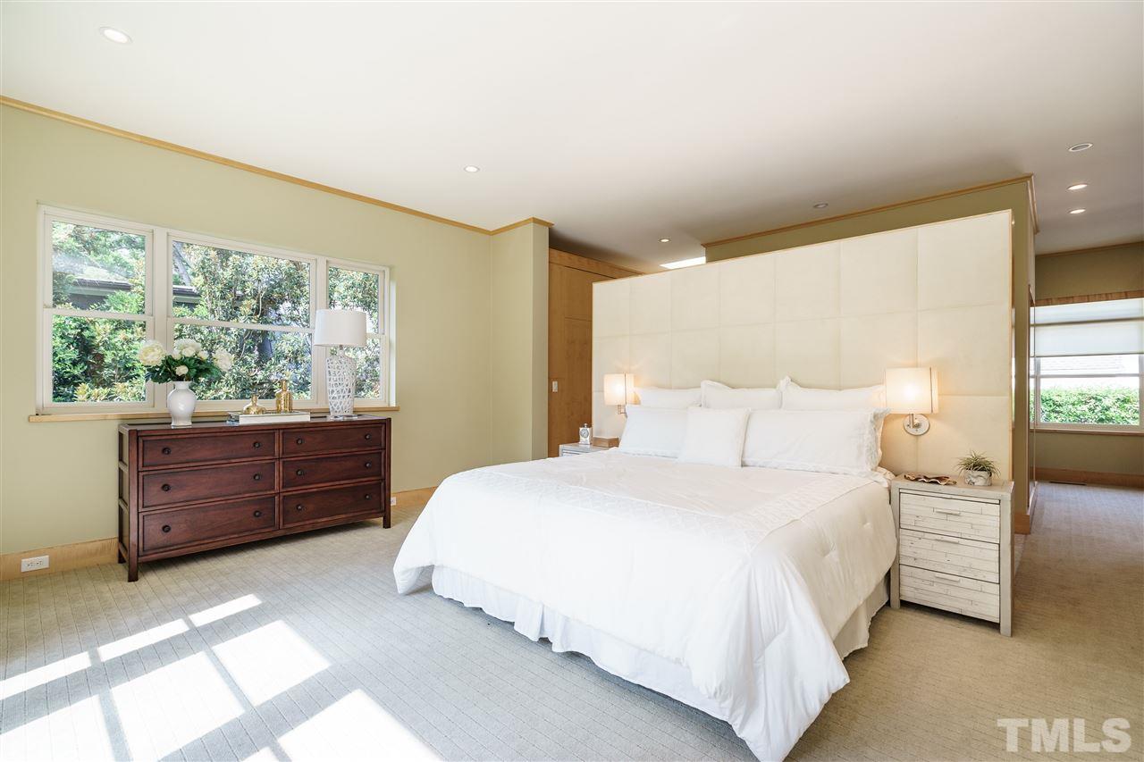931 Vance Street Raleigh, NC 27608 - Photo 12 of 25 a bedroom with a bed and window