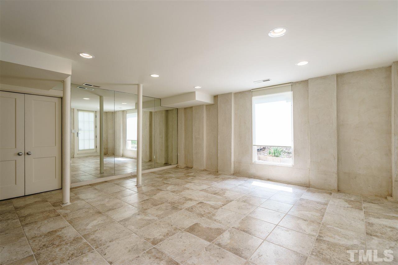 931 Vance Street Raleigh, NC 27608 - Photo 20 of 25 a view of an empty room with a window