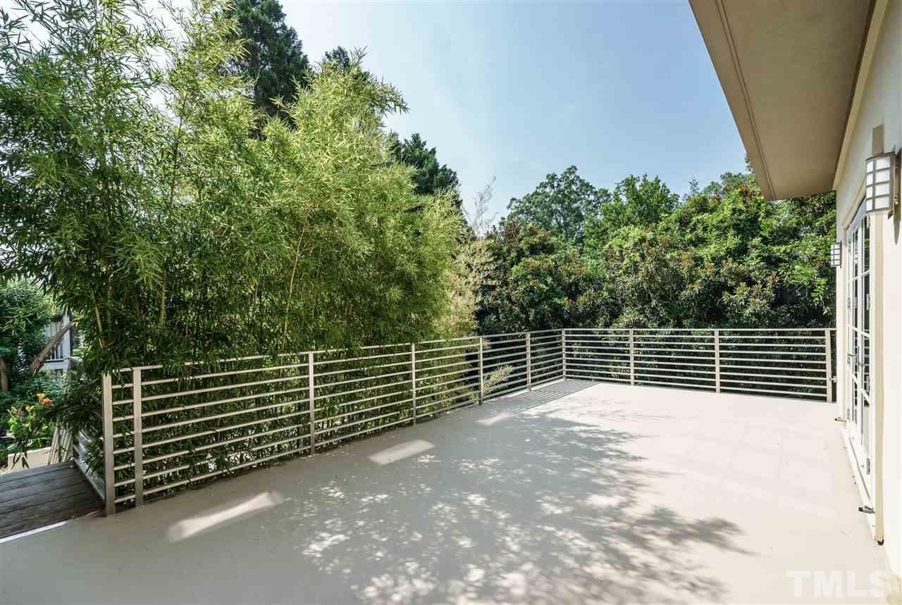 931 Vance Street Raleigh, NC 27608 - Photo 22 of 25 a view of a room with stairs and wooden fence