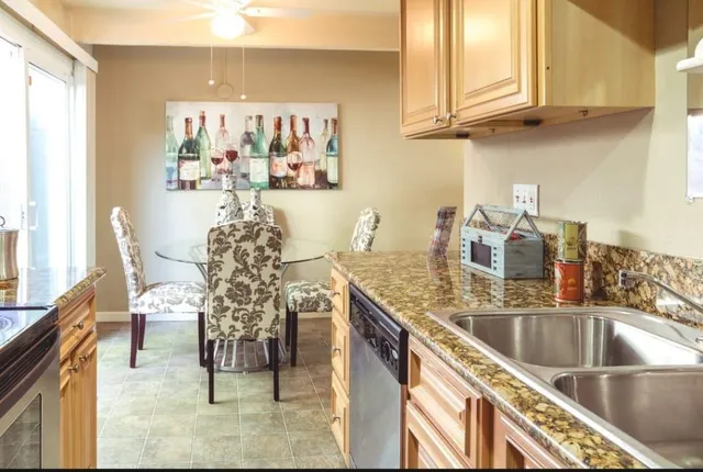 a kitchen with a sink and cabinets