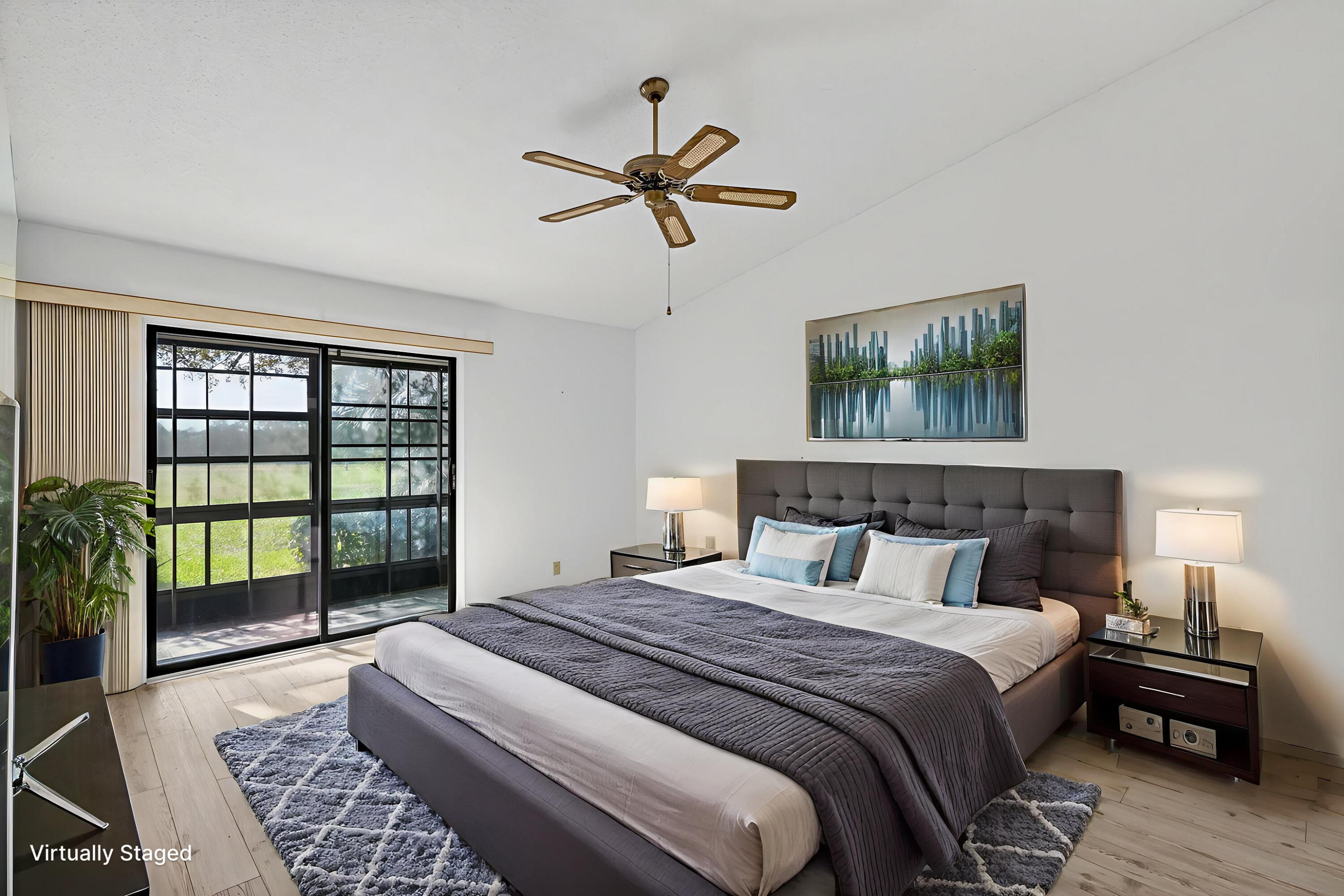 6184 Southeast Georgetown Place Hobe Sound, FL 33455 - Photo 11 of 29 a bedroom with a large bed and a window