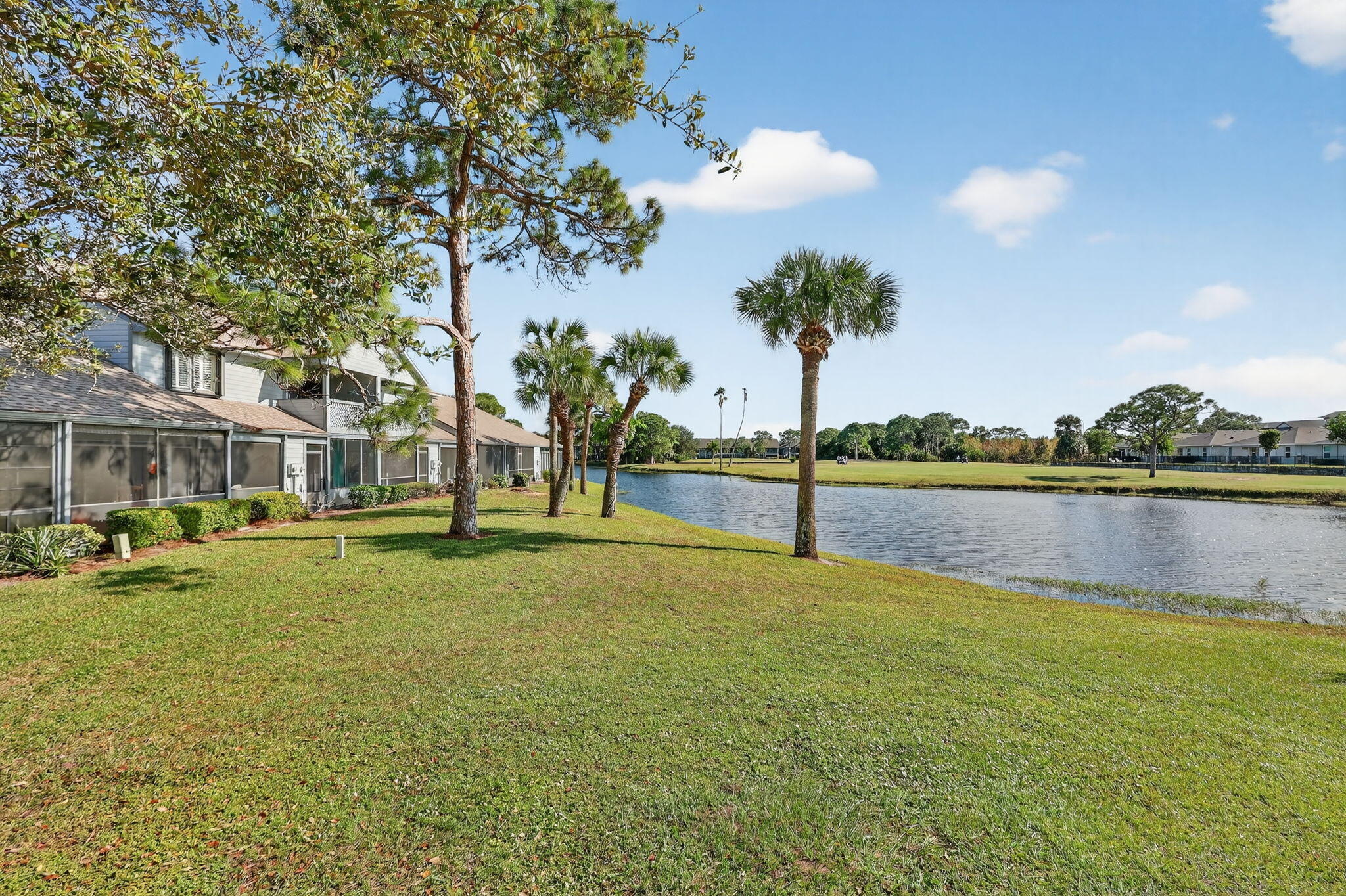 6184 Southeast Georgetown Place Hobe Sound, FL 33455 - Photo 19 of 29 a view of a lake with houses
