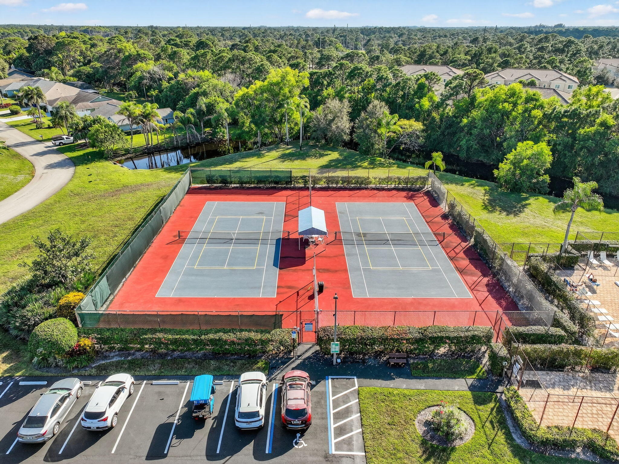 6184 Southeast Georgetown Place Hobe Sound, FL 33455 - Photo 24 of 29 a view of swimming pool with outdoor seating and yard
