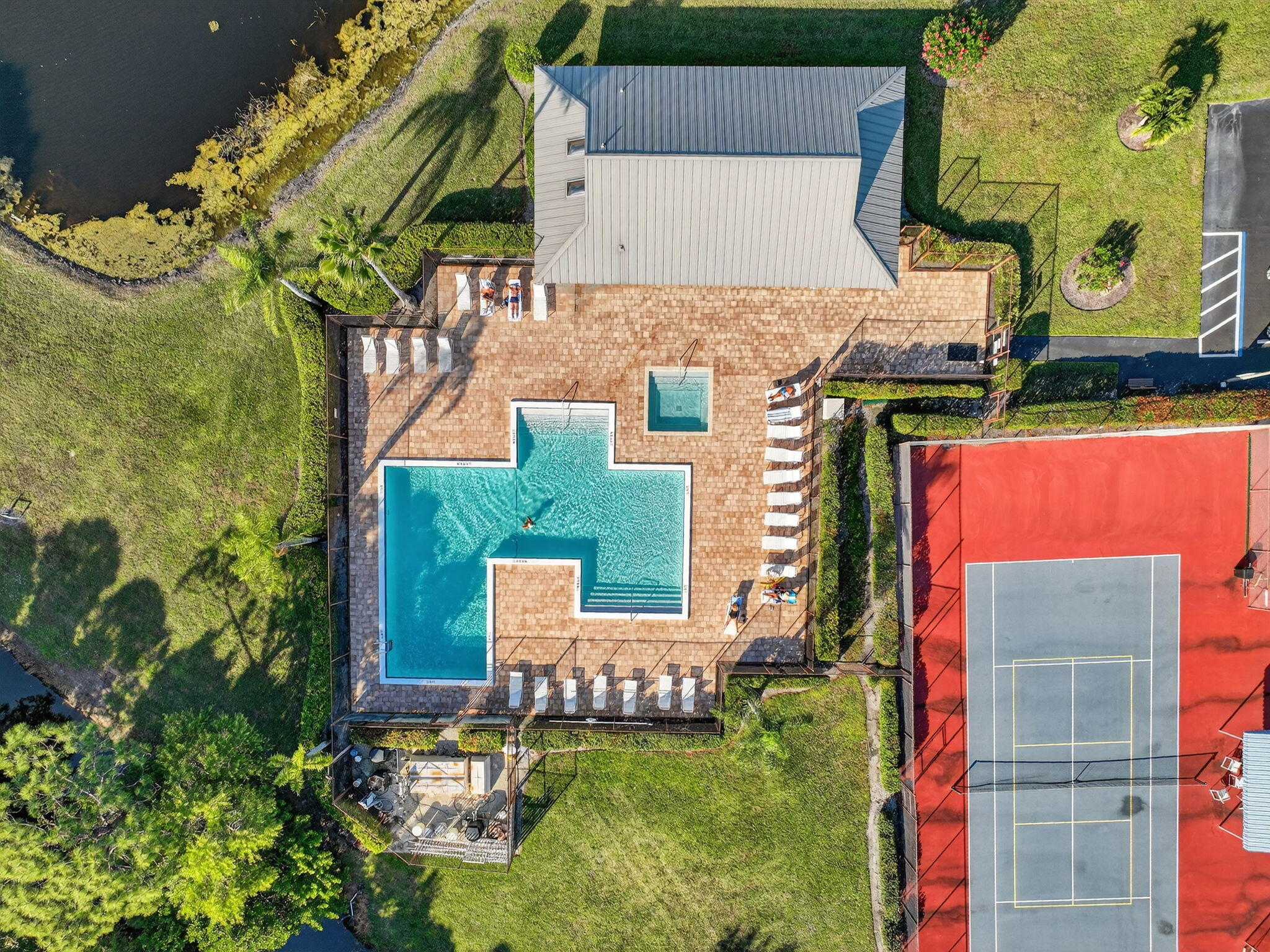 6184 Southeast Georgetown Place Hobe Sound, FL 33455 - Photo 26 of 29 an aerial view of a house with a garden