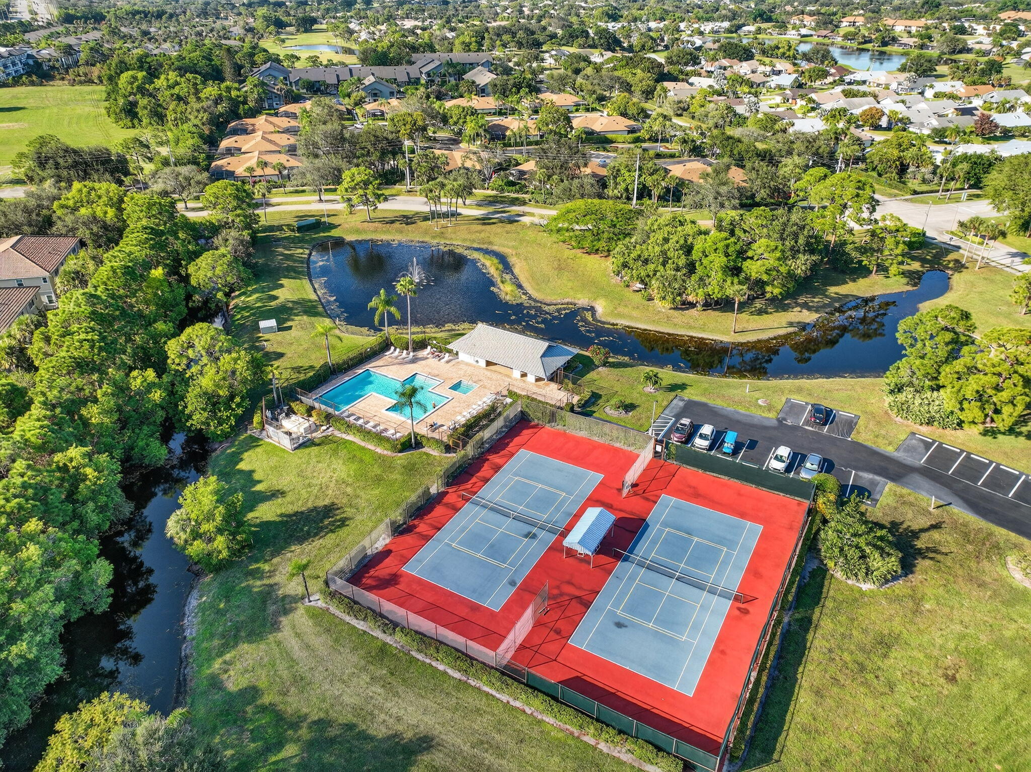 6184 Southeast Georgetown Place Hobe Sound, FL 33455 - Photo 27 of 29 an aerial view of a pool patio swimming pool and outdoor seating