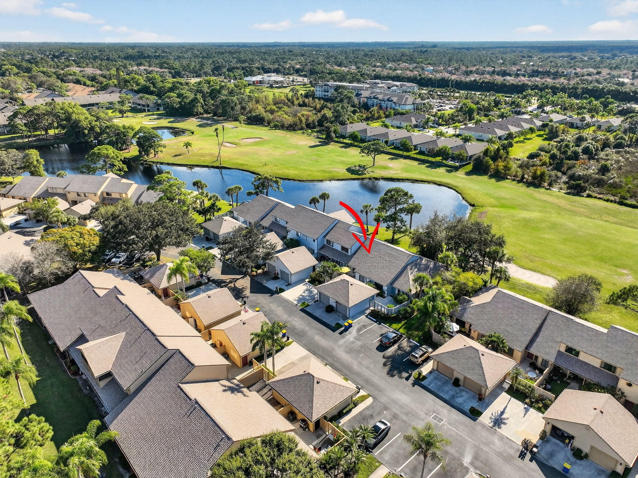 6184 Southeast Georgetown Place Hobe Sound, FL 33455 - Photo 29 of 29 an aerial view of a house with a swimming pool a yard and mountain view in back