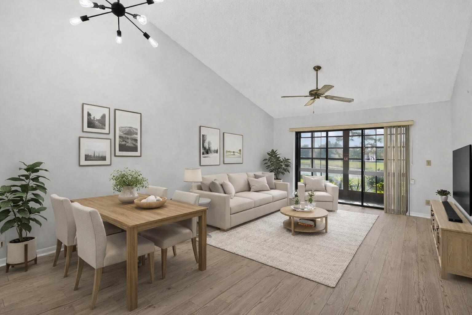 6184 Southeast Georgetown Place Hobe Sound, FL 33455 - Photo 4 of 29 a living room with furniture and a large window