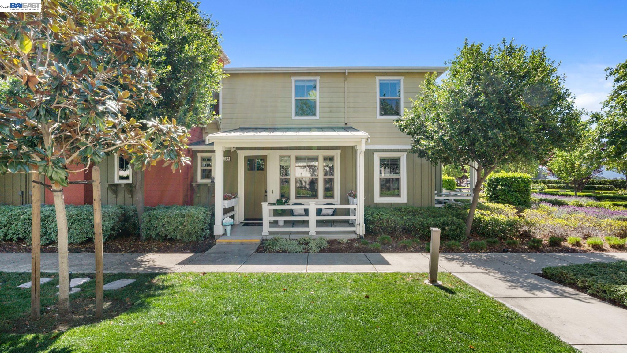a front view of a house with a garden