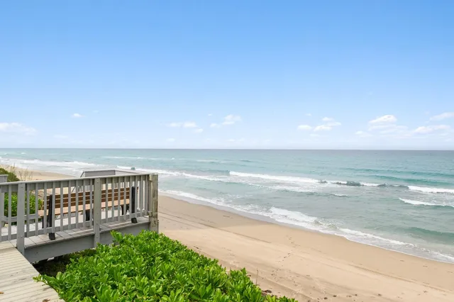 a view of a swimming pool with an outdoor seating