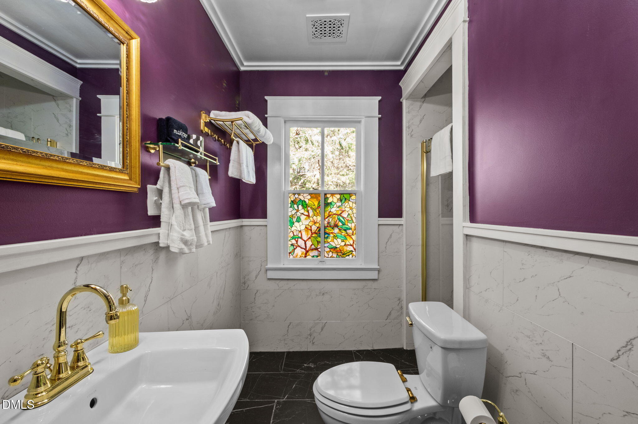 7891 Boston Road Roxboro, NC 27574 - Photo 47 of 85 a bathroom with a sink a toilet and a mirror