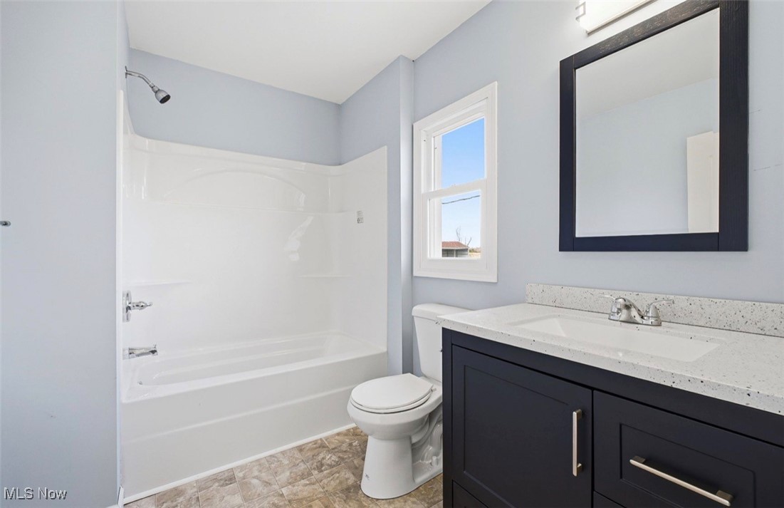 1635 Irish Ridge Road Philo, OH 43771 - Photo 22 of 48 Full bathroom featuring vanity and bathtub / shower combination