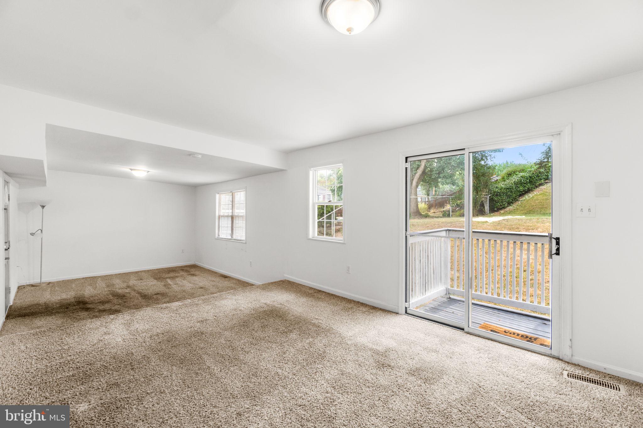 215 Cheddington Road Linthicum Heights, MD 21090 - Photo 13 of 41 a view of an empty room with a window