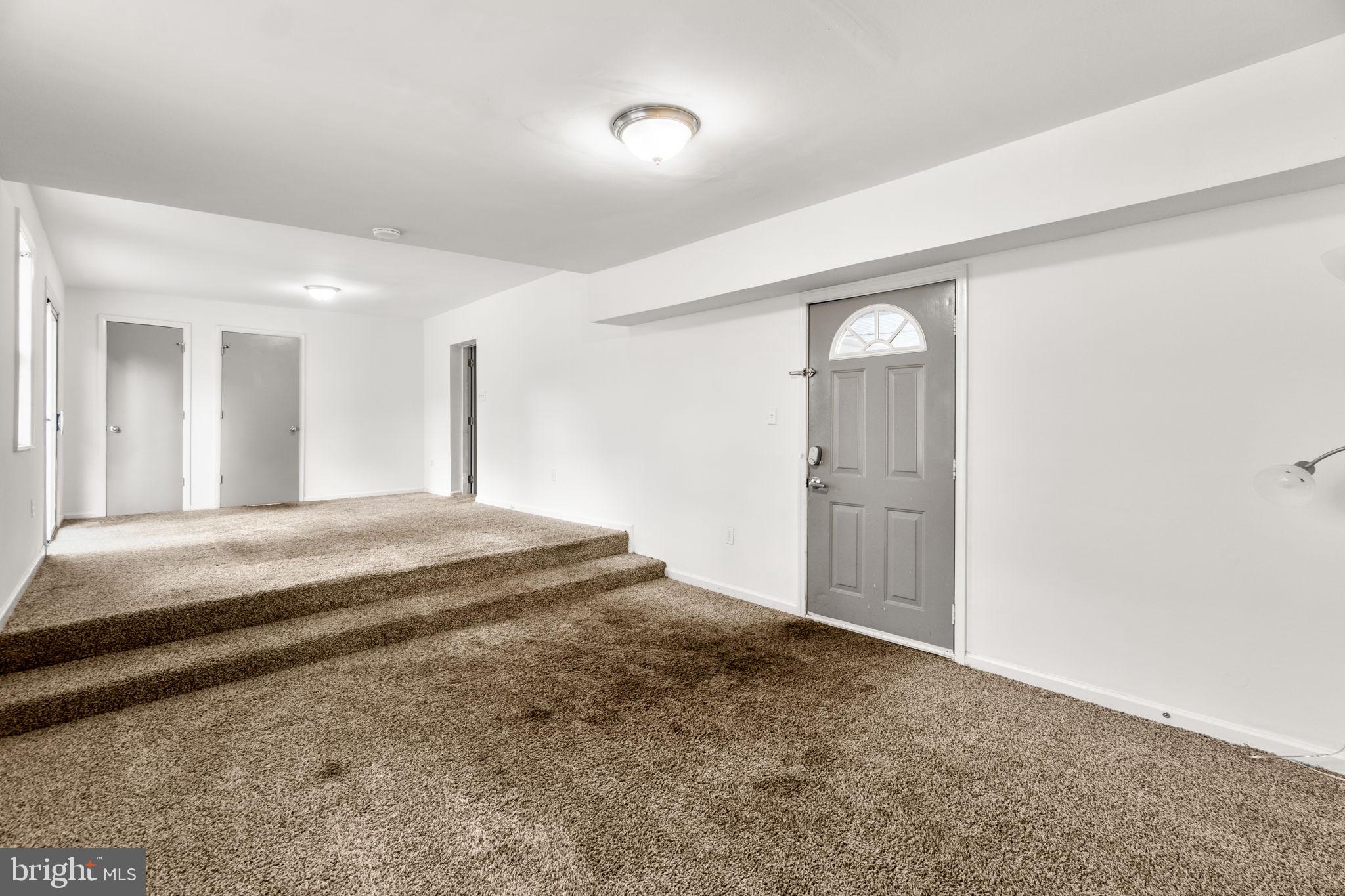 215 Cheddington Road Linthicum Heights, MD 21090 - Photo 15 of 41 a spacious bedroom with a bed and a cabinets