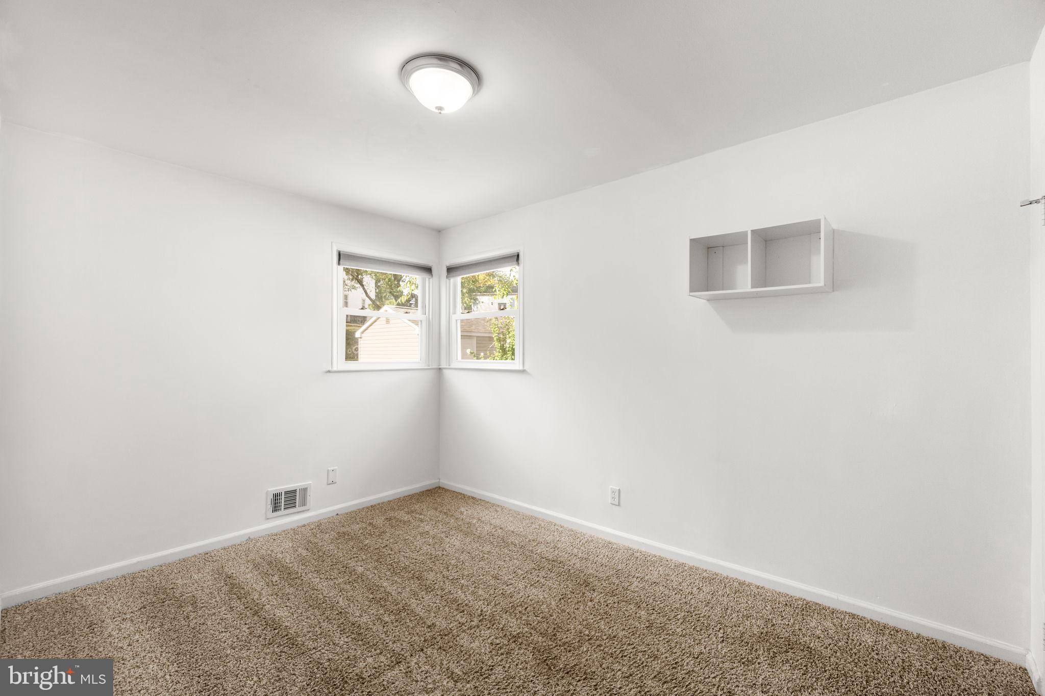 215 Cheddington Road Linthicum Heights, MD 21090 - Photo 18 of 41 an empty room with windows