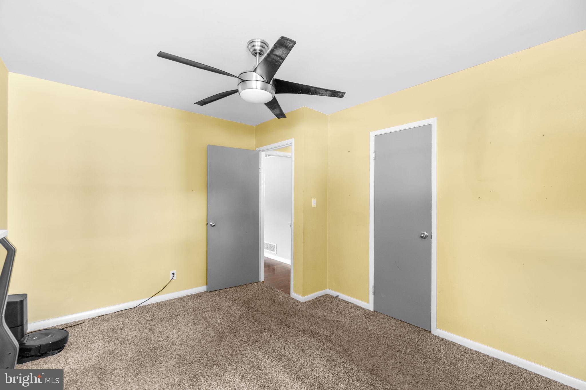 215 Cheddington Road Linthicum Heights, MD 21090 - Photo 24 of 41 a view of a hallway with a ceiling fan