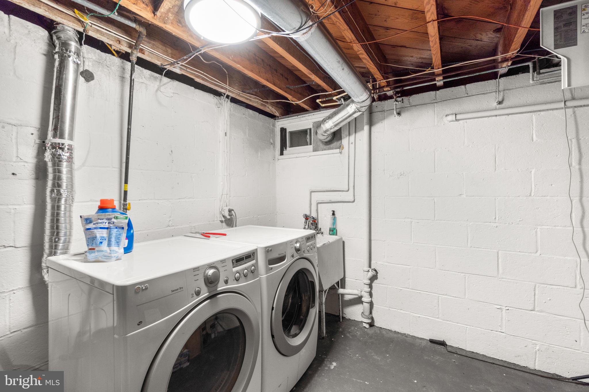 215 Cheddington Road Linthicum Heights, MD 21090 - Photo 32 of 41 a utility room with dryer and washer