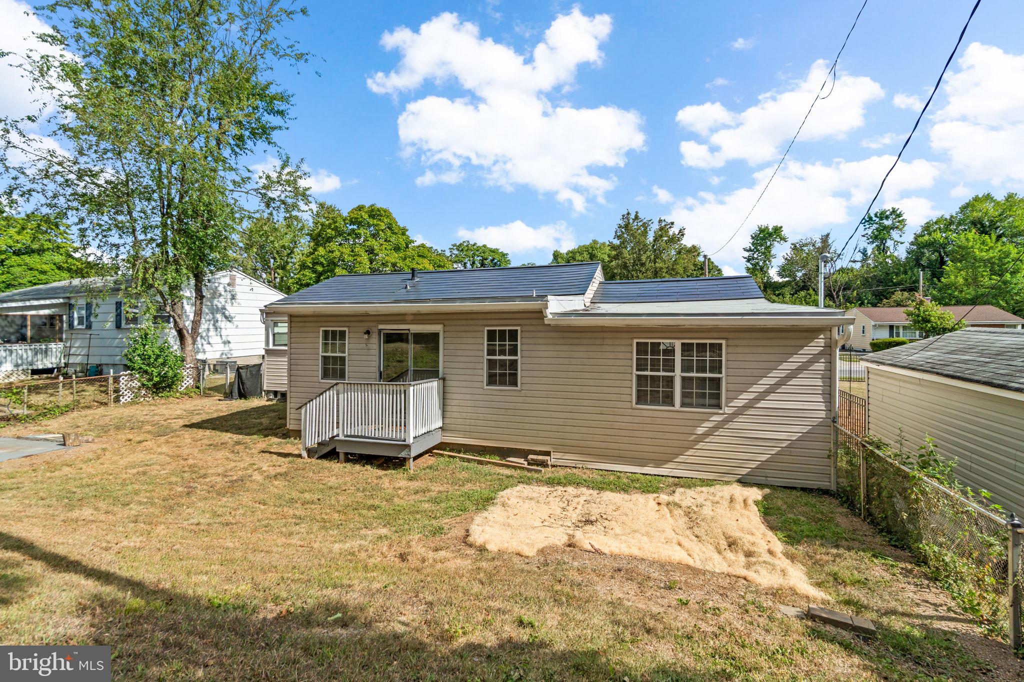 215 Cheddington Road Linthicum Heights, MD 21090 - Photo 37 of 41 a view of a house with a yard