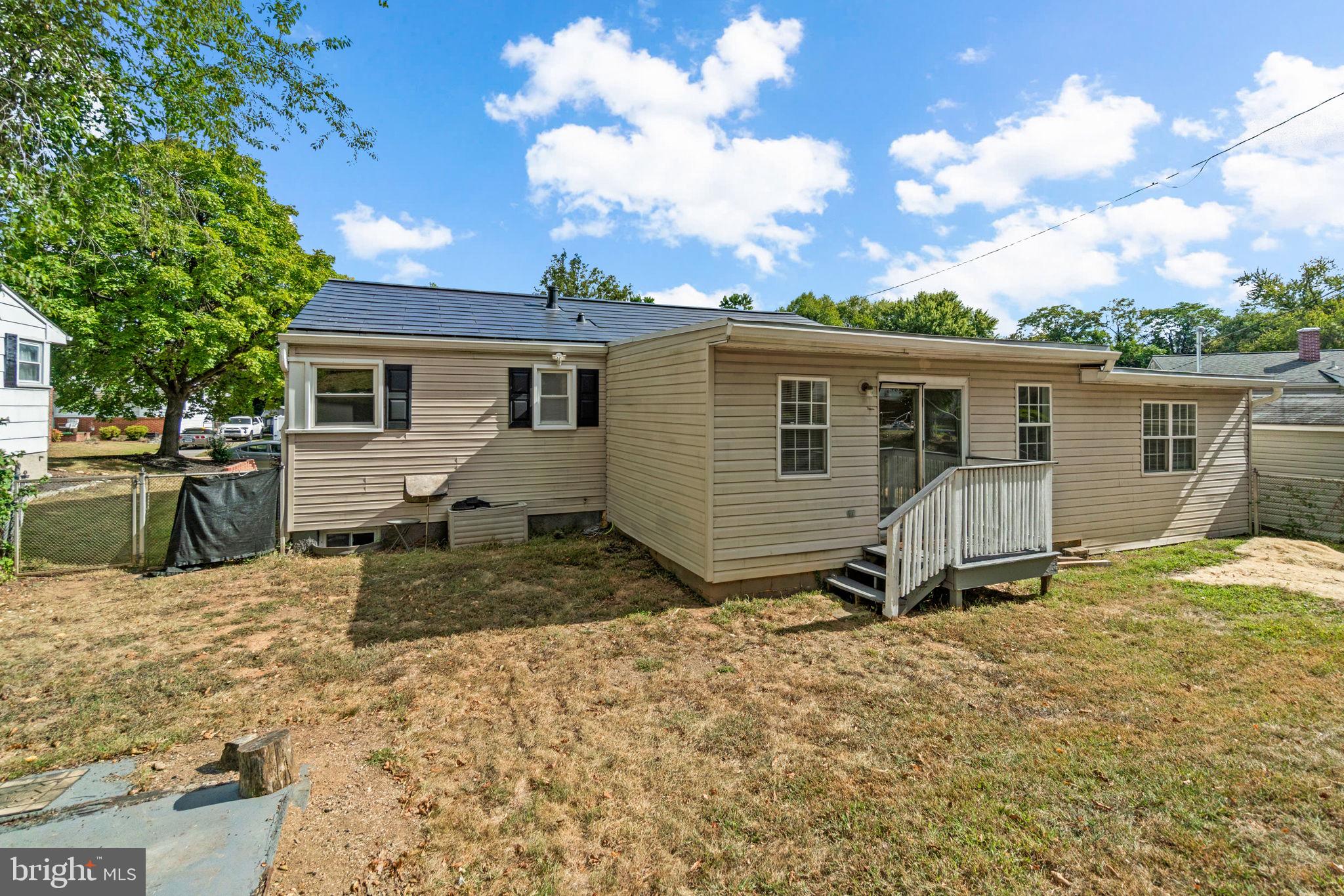 215 Cheddington Road Linthicum Heights, MD 21090 - Photo 38 of 41 a view of a house with a patio