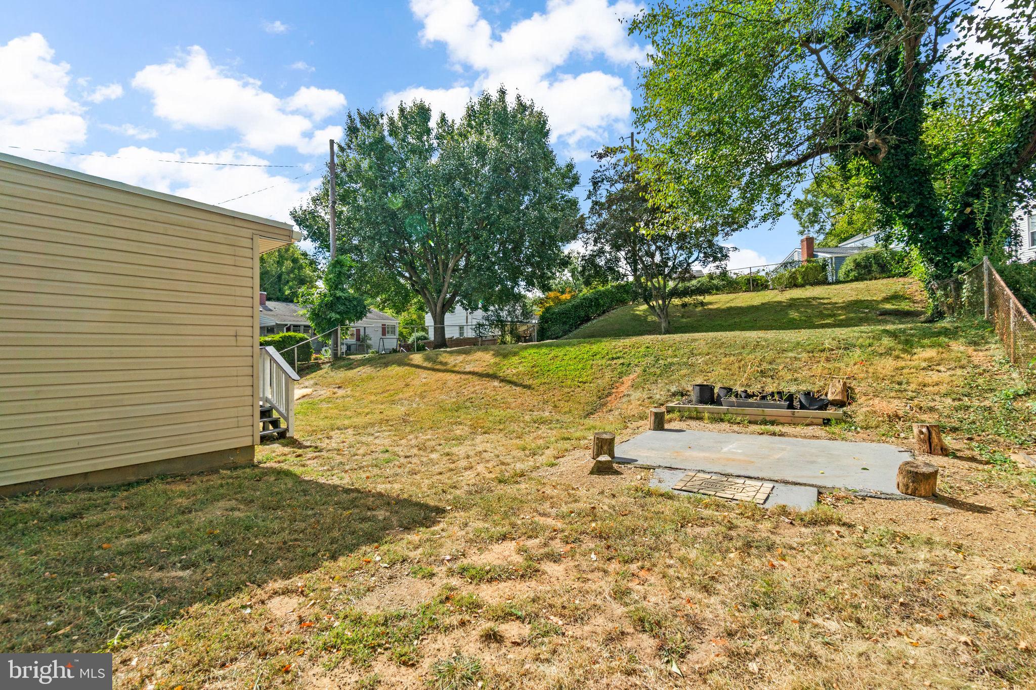 215 Cheddington Road Linthicum Heights, MD 21090 - Photo 39 of 41 a view of a yard with wooden fence