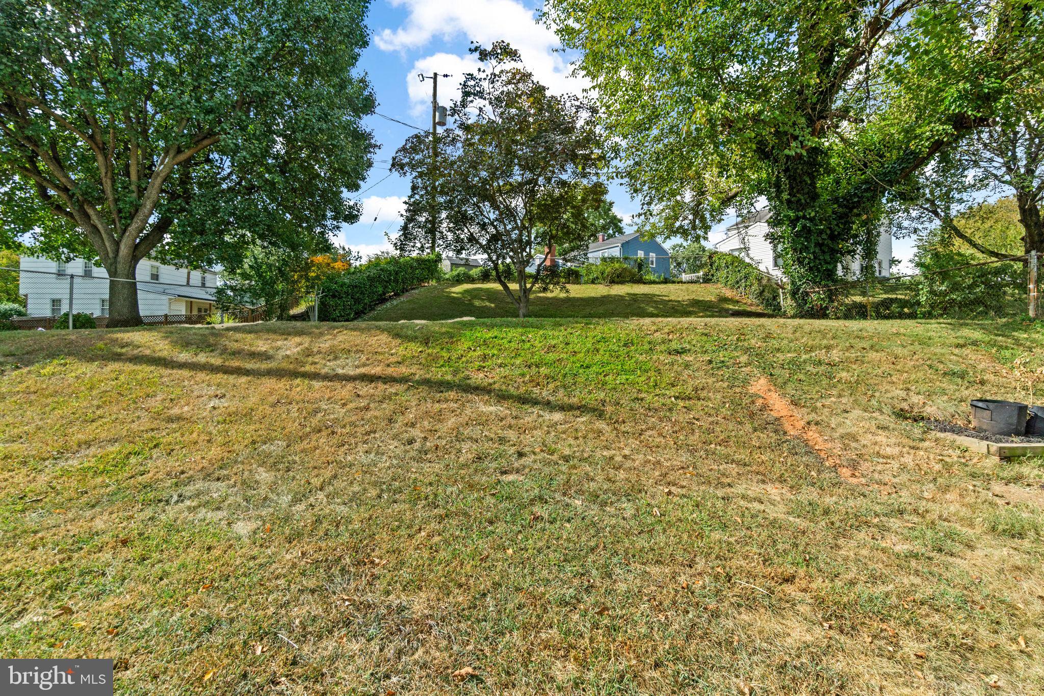 215 Cheddington Road Linthicum Heights, MD 21090 - Photo 40 of 41 a view of a yard with plants and trees