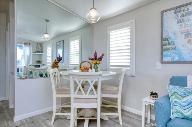 a view of a dining room with furniture and window