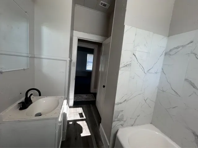 a bathroom with a toilet and a sink