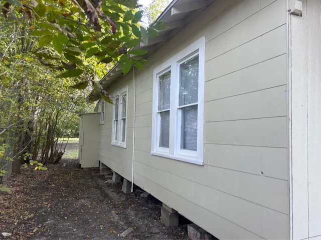 a house with a tree in the background