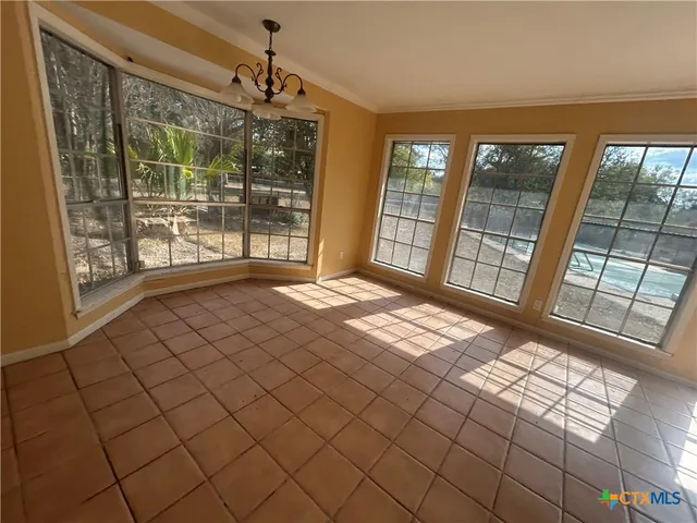 a view of an empty room and window