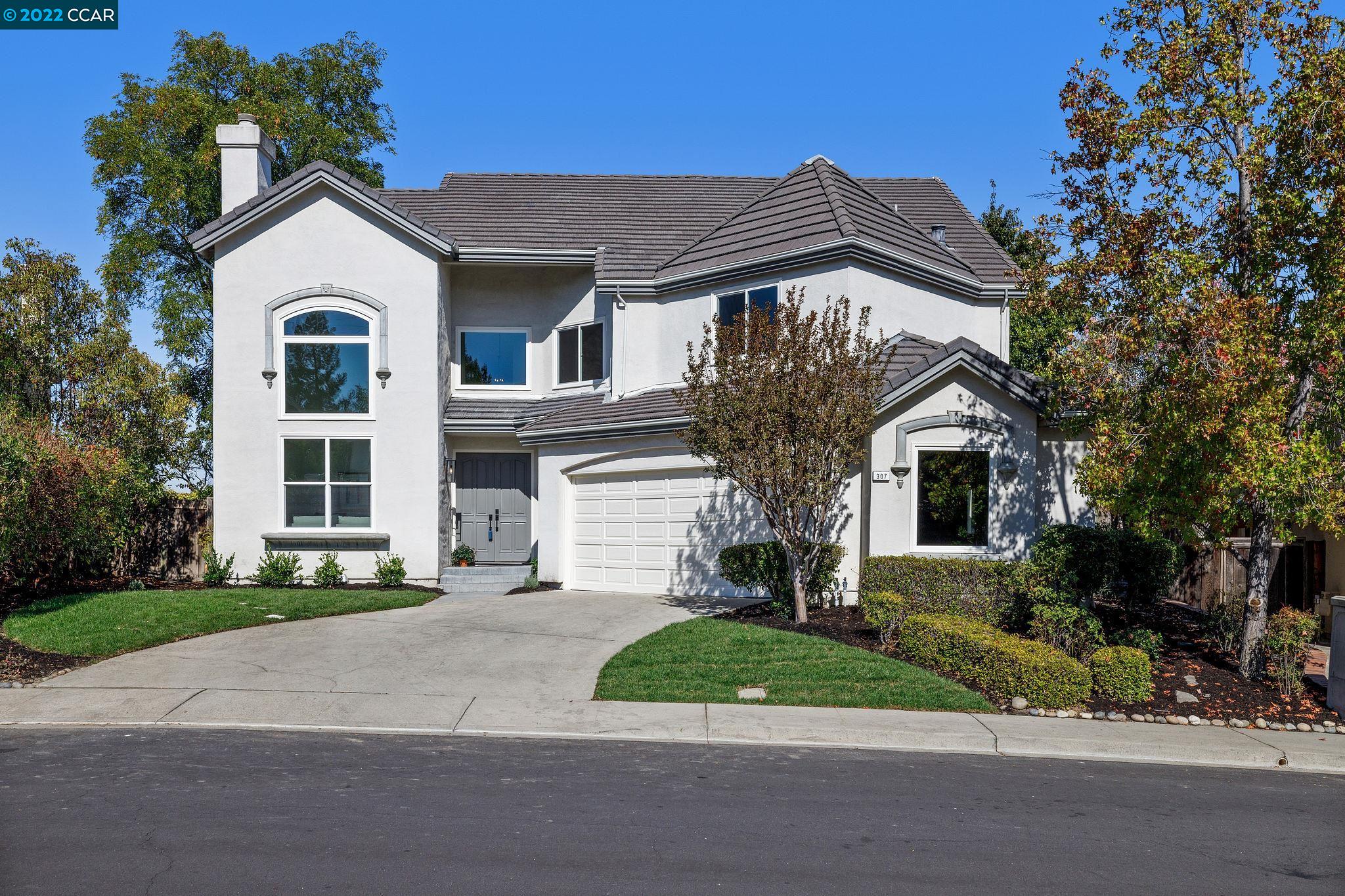 307 Zagora Drive Danville, CA 94506 - Photo 1 of 1 a front view of a house with a garden and plants