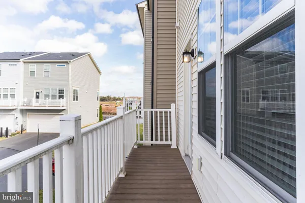 a view of a balcony with wooden floor