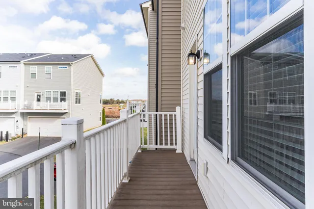 a view of a balcony with wooden floor