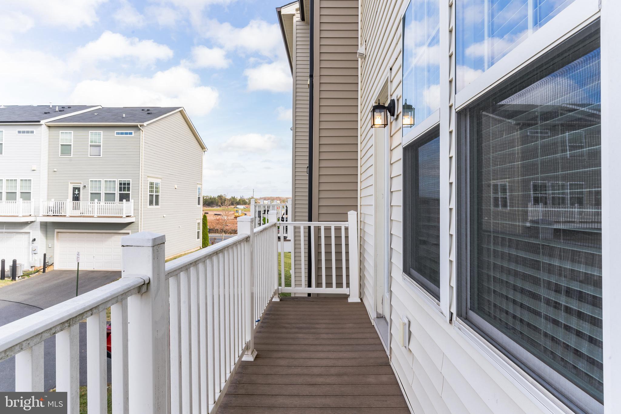 25621 Pleasant Valley Road Chantilly, VA 20152 - Photo 20 of 52 a view of a balcony with wooden floor