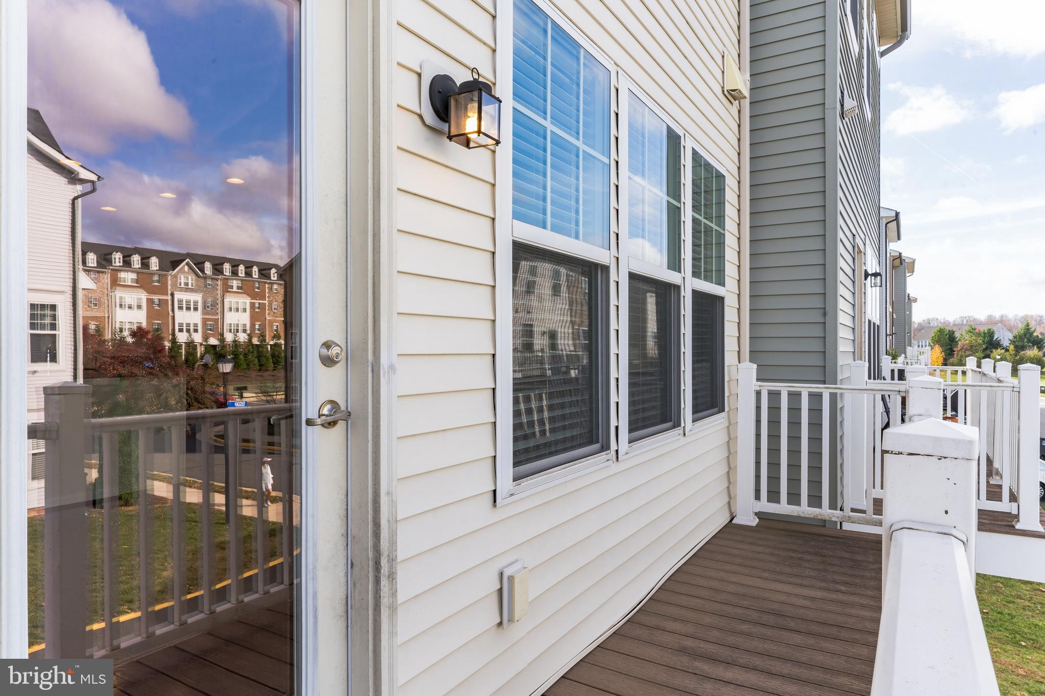 25621 Pleasant Valley Road Chantilly, VA 20152 - Photo 22 of 52 a view of a balcony with furniture and wooden floor
