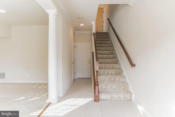 a view of a tennis ground with large trees