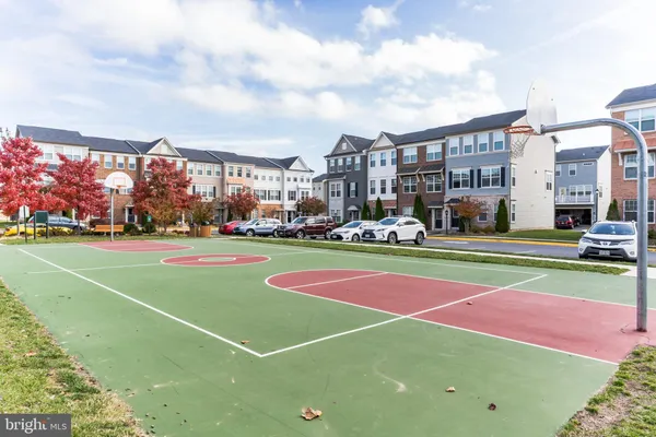 a view of yard with swimming pool and green space