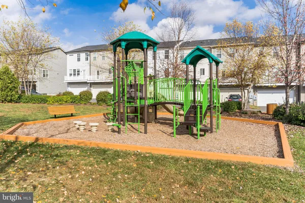 a view of a park with iron fence