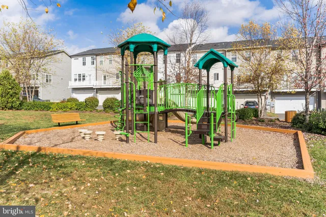 a view of a park with iron fence