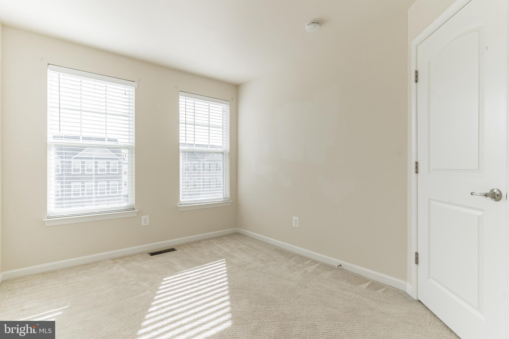 25621 Pleasant Valley Road Chantilly, VA 20152 - Photo 10 of 52 a view of an empty room with a window