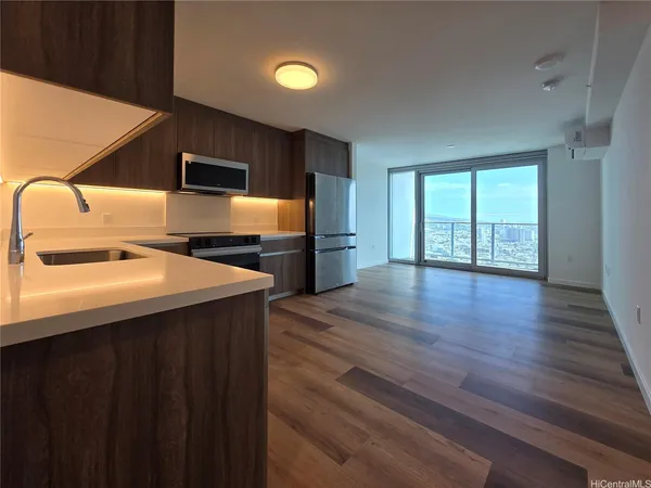 a kitchen with sink cabinets and wooden floor