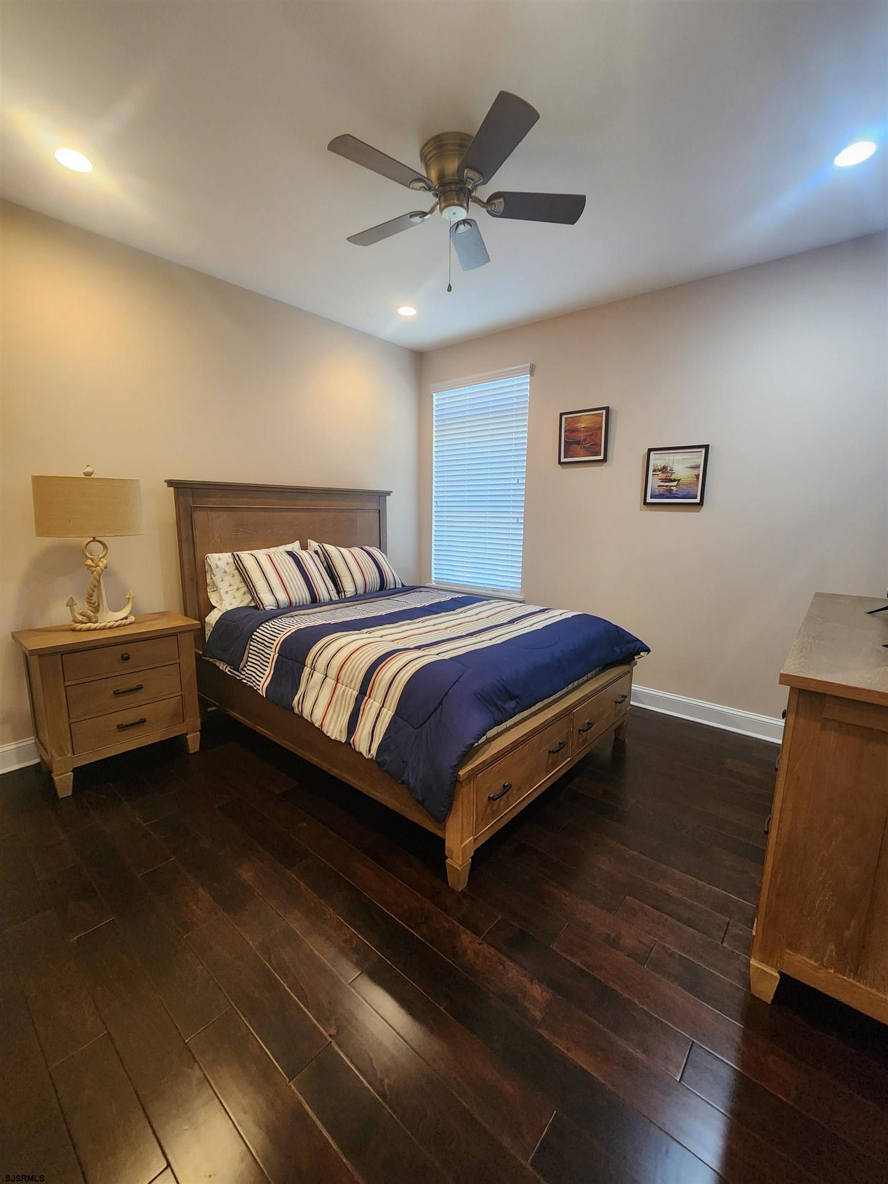 16 North Decatur Avenue, Unit 1 Margate City, NJ 08402 - Photo 13 of 29 a bedroom with a bed and window