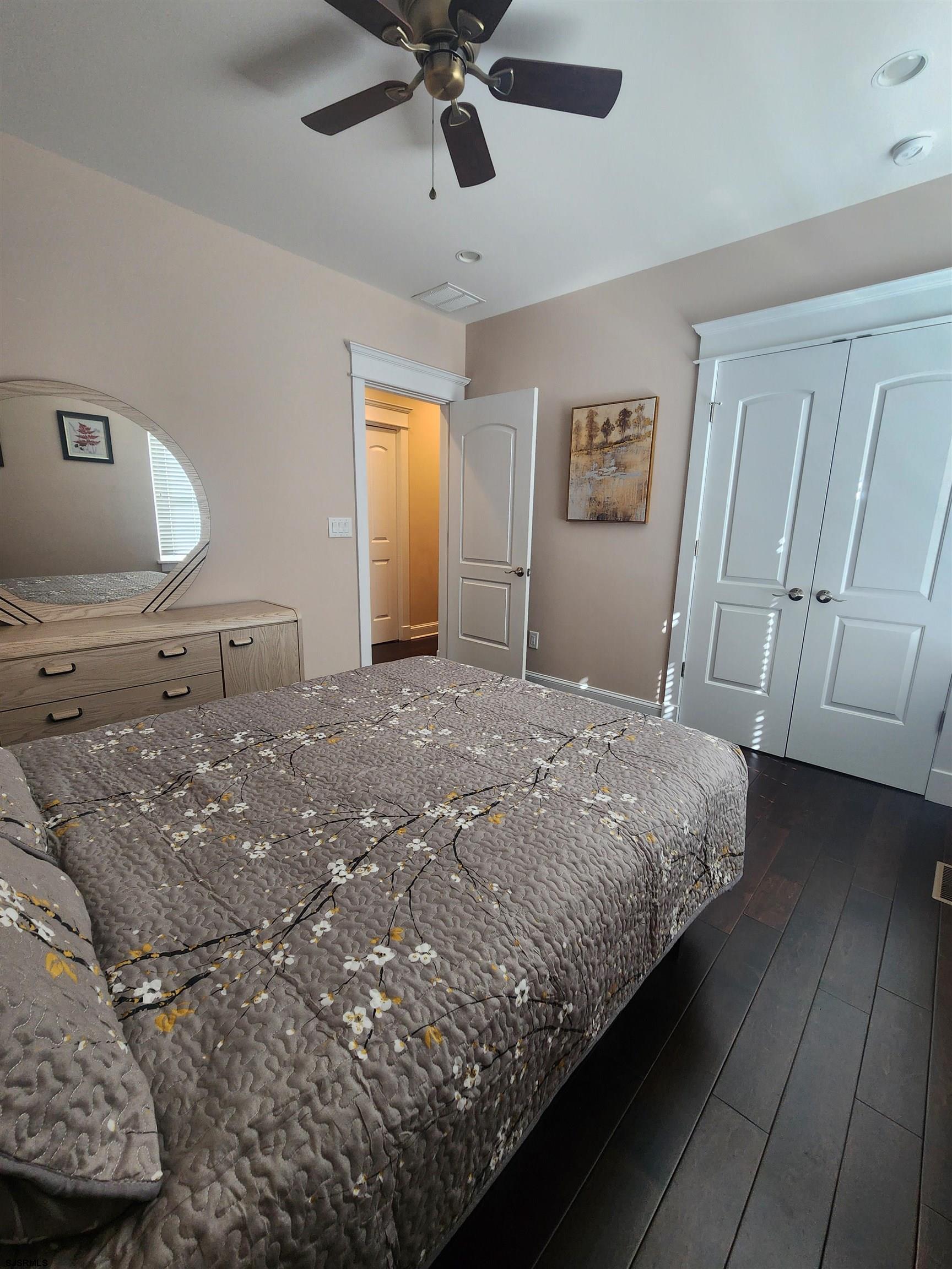 16 North Decatur Avenue, Unit 1 Margate City, NJ 08402 - Photo 16 of 29 a bedroom with a large bed and ceiling fan