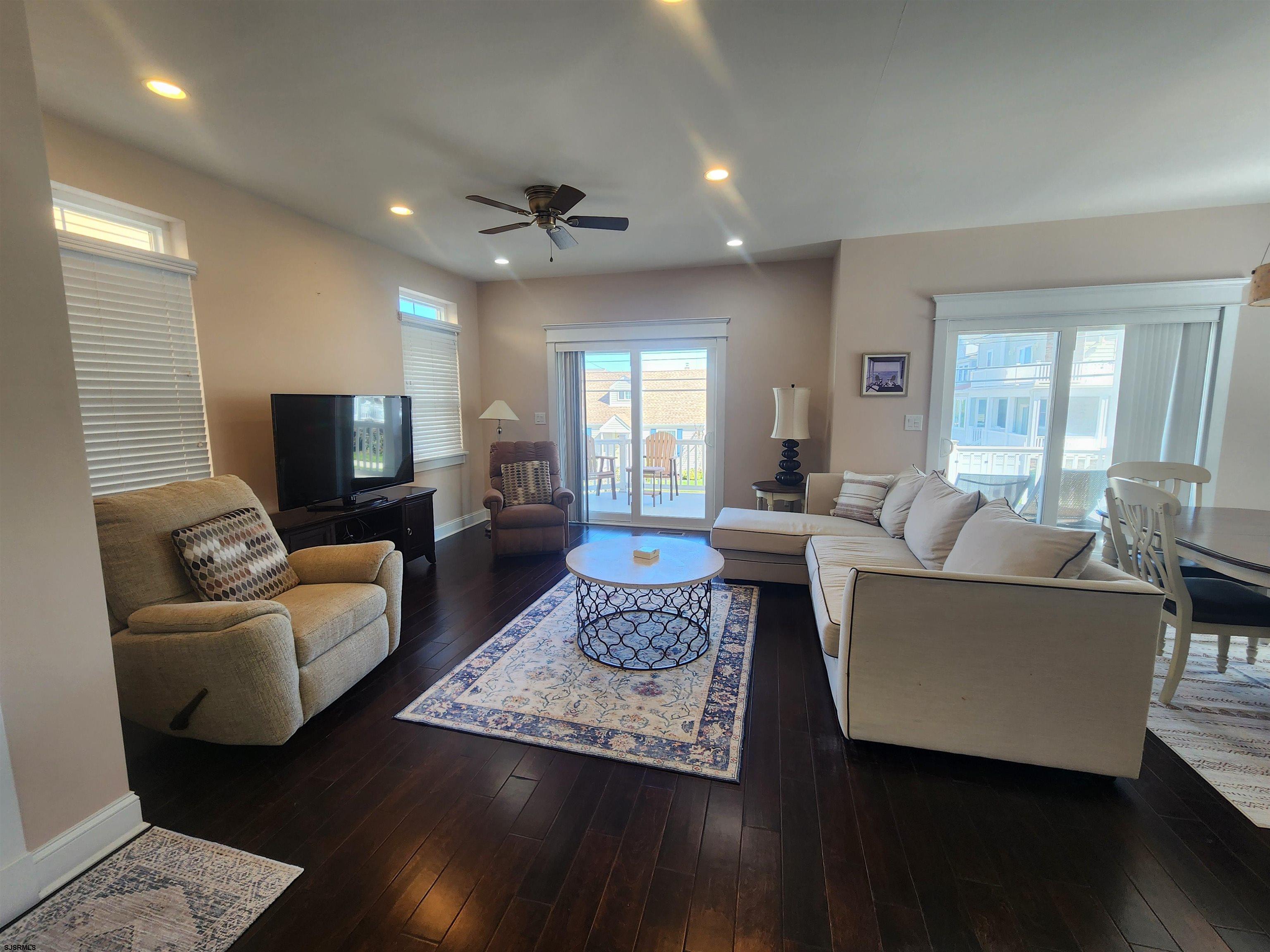 16 North Decatur Avenue, Unit 1 Margate City, NJ 08402 - Photo 2 of 29 a living room with furniture and a flat screen tv