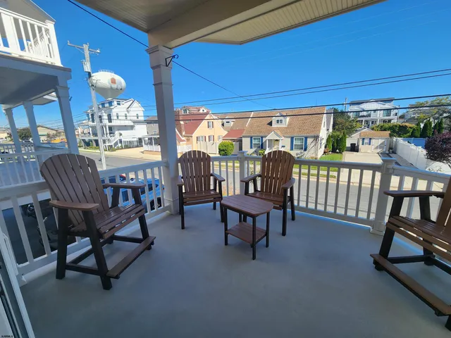 a view of a porch with furniture and yard