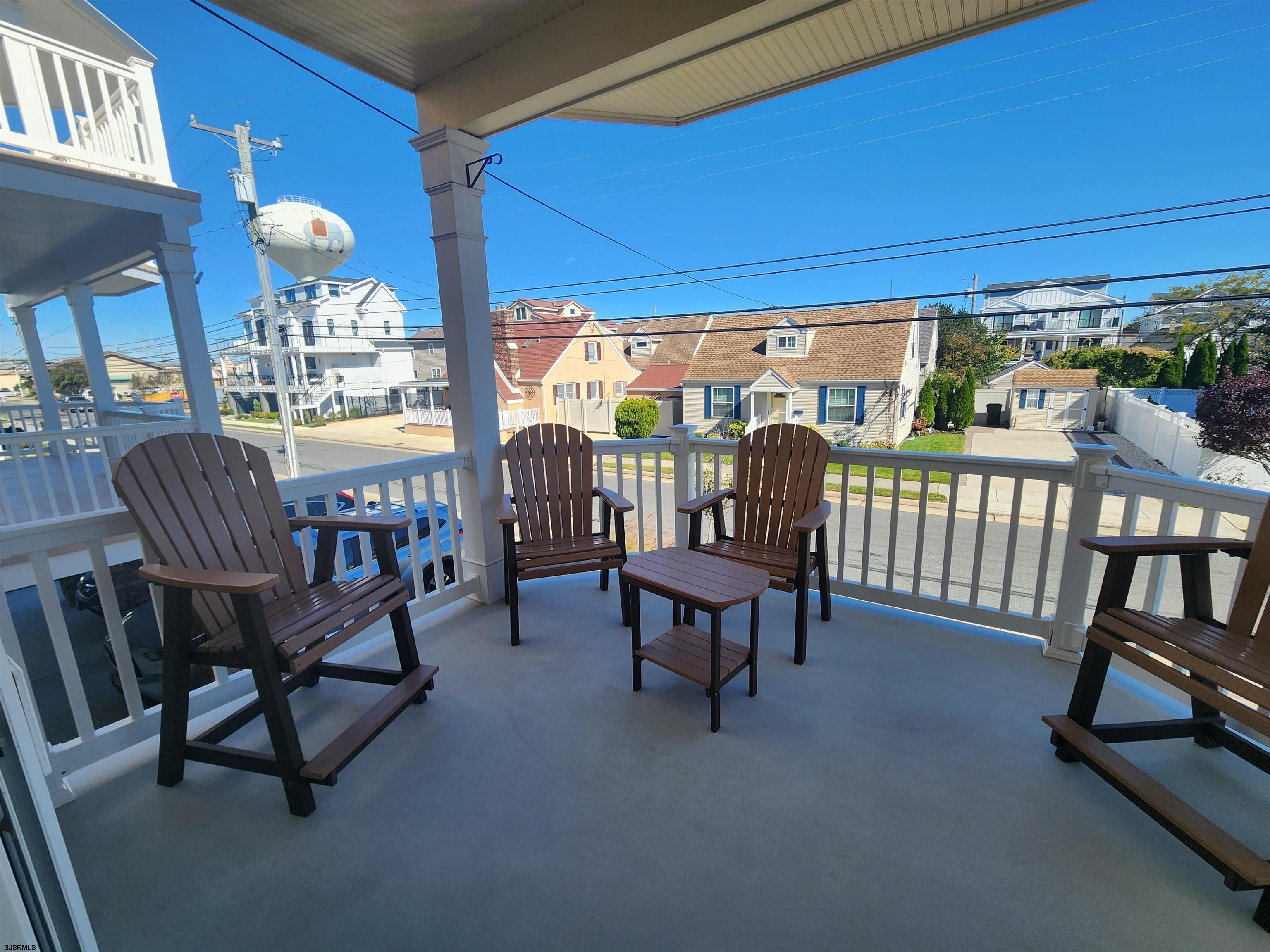 16 North Decatur Avenue, Unit 1 Margate City, NJ 08402 - Photo 8 of 29 a view of a porch with furniture and yard