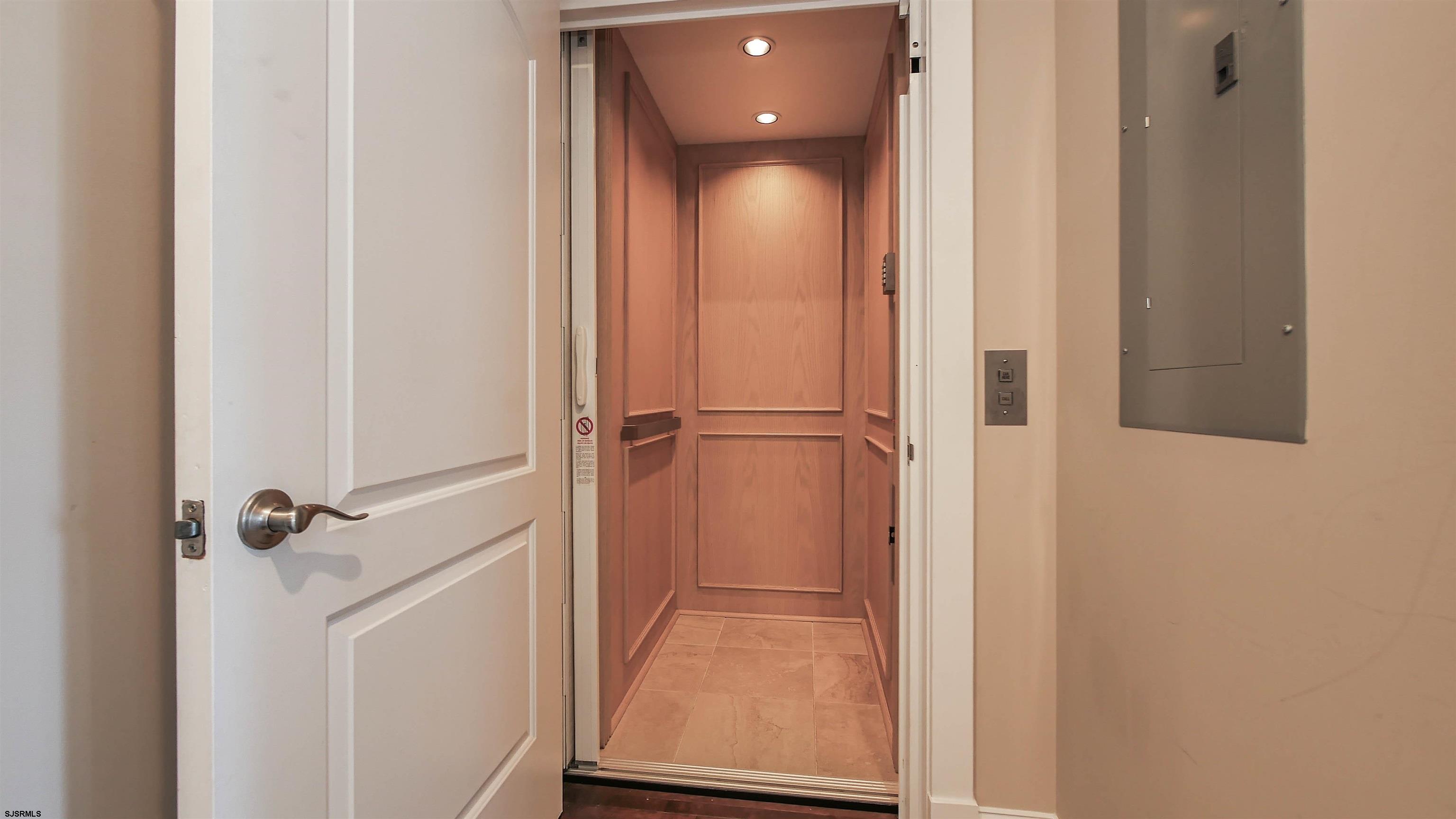 16 North Decatur Avenue, Unit 1 Margate City, NJ 08402 - Photo 10 of 29 a view of a hallway with a elevator