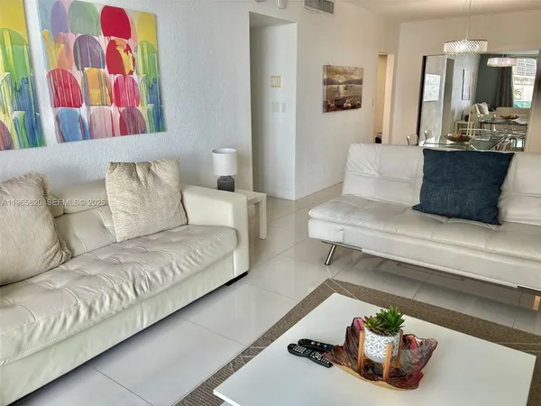 a living room with furniture and flat screen tv
