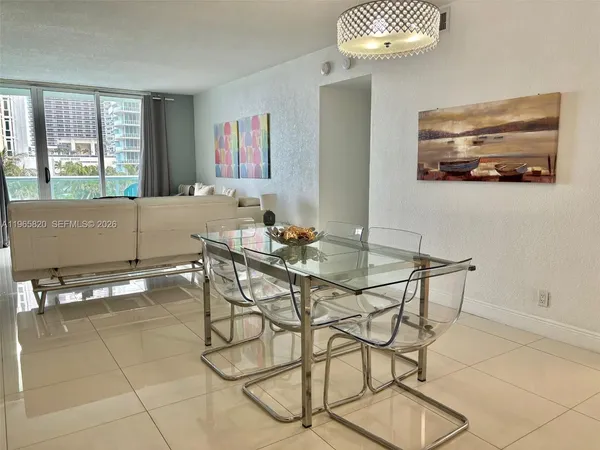 a dining room with furniture and window