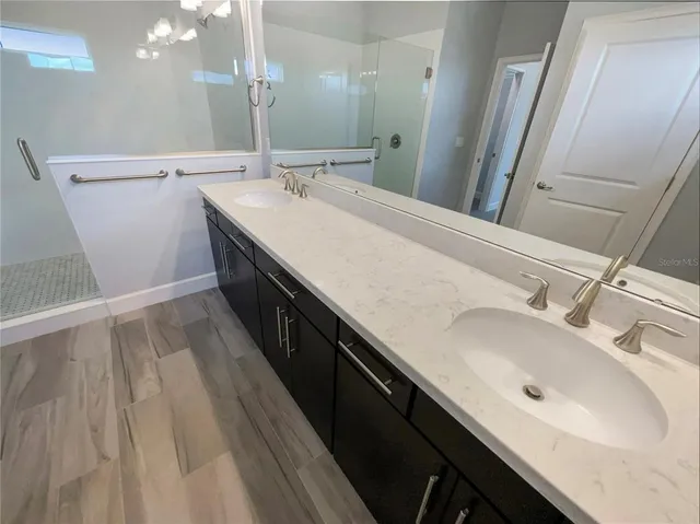 a bathroom with a sink and a mirror